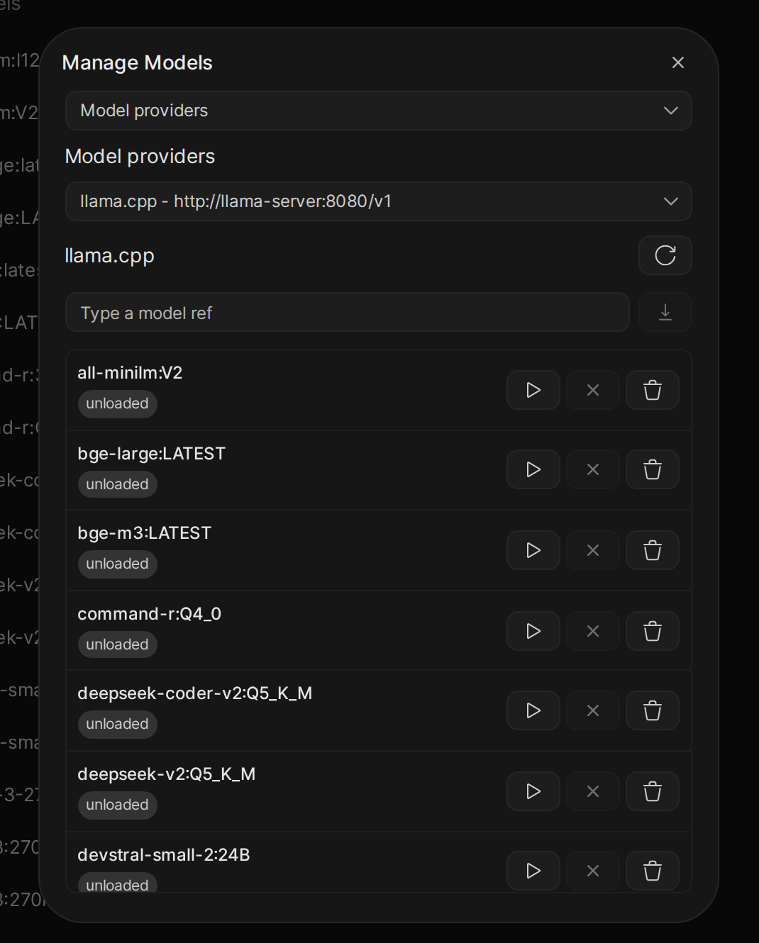 The Manage Models dialog on a llama.cpp connection, listing models with load, unload, and remove buttons and a box for a model reference to download